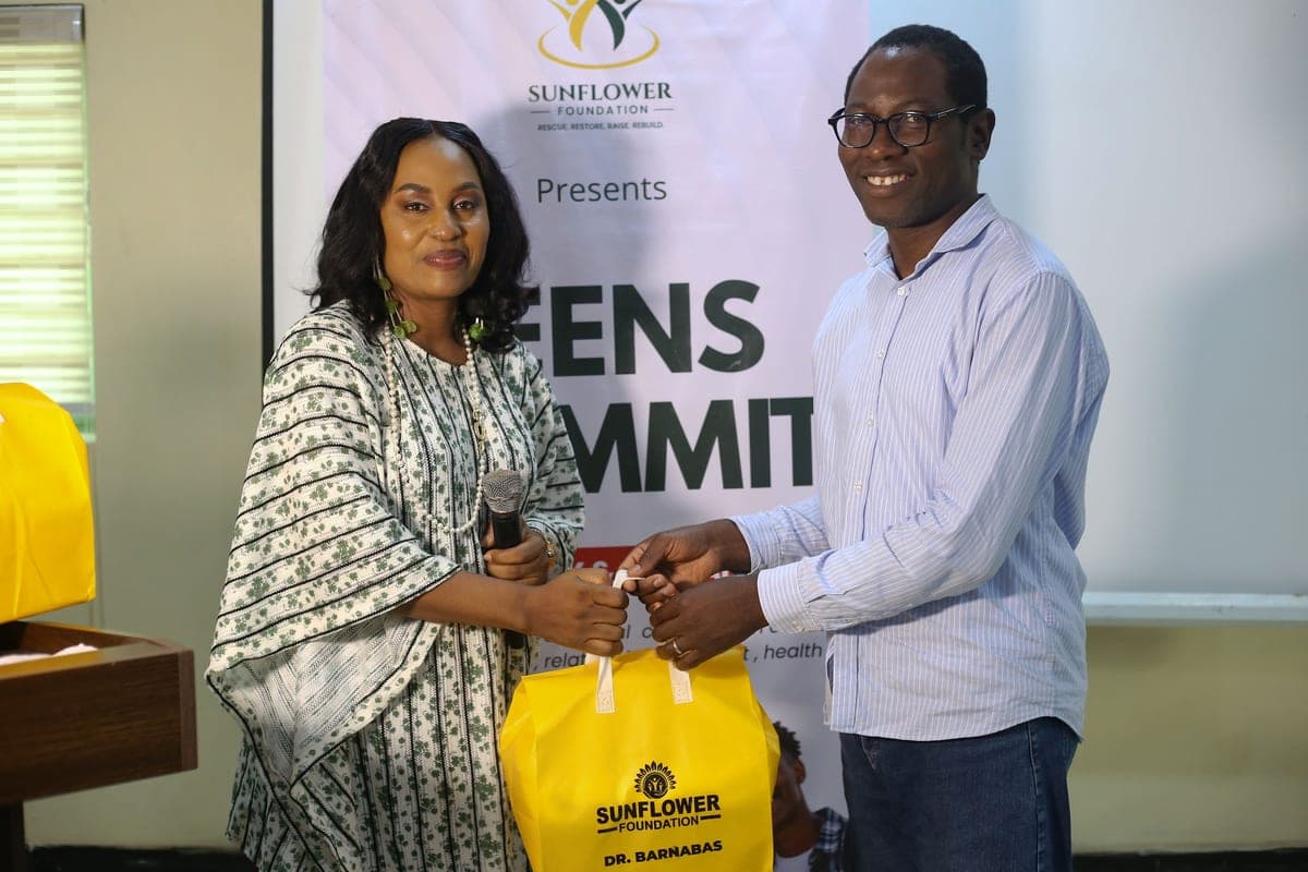 A Sunflower Foundation gift bag being presented to a participant at the Teens Summit